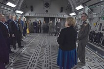 People standing inside a C-17 Globemaster III