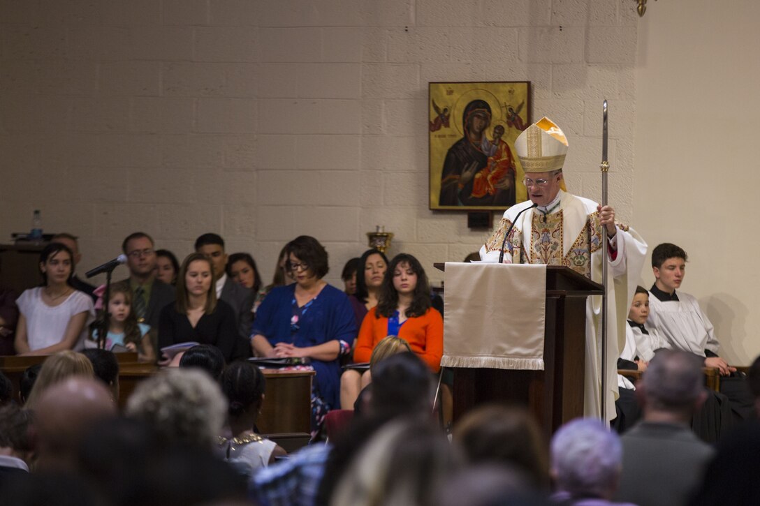 U.S. Marines and civilians attend a mass at the St. Francis Xavier Catholic Chapel on Marine Corps Base Camp Lejeune, Jan 28, 2018.