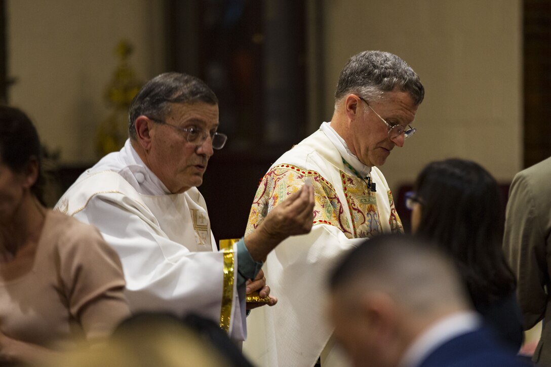 U.S. Marines and civilians attend a mass at the St. Francis Xavier Catholic Chapel on Marine Corps Base Camp Lejeune, Jan 28, 2018.