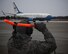 On a cold and blustery winter day, 932nd Maintenance Group personnel were out bringing in planes from various missions.  Here, bundled up with gloves and safety gear, Tech Sgt. Anthony Fritz, a flying crew chief, directs a C-40C plane to the proper parking spot Jan. 16, 2018, at Scott Air Force Base, Ill.  The 932nd Airlift Wing is the only Air Force Reserve Command wing flying the unique C-40 mission, and maintainers take precise care of four of these airplanes.  (U.S. Air Force photo by Lt. Col. Stan Paregien