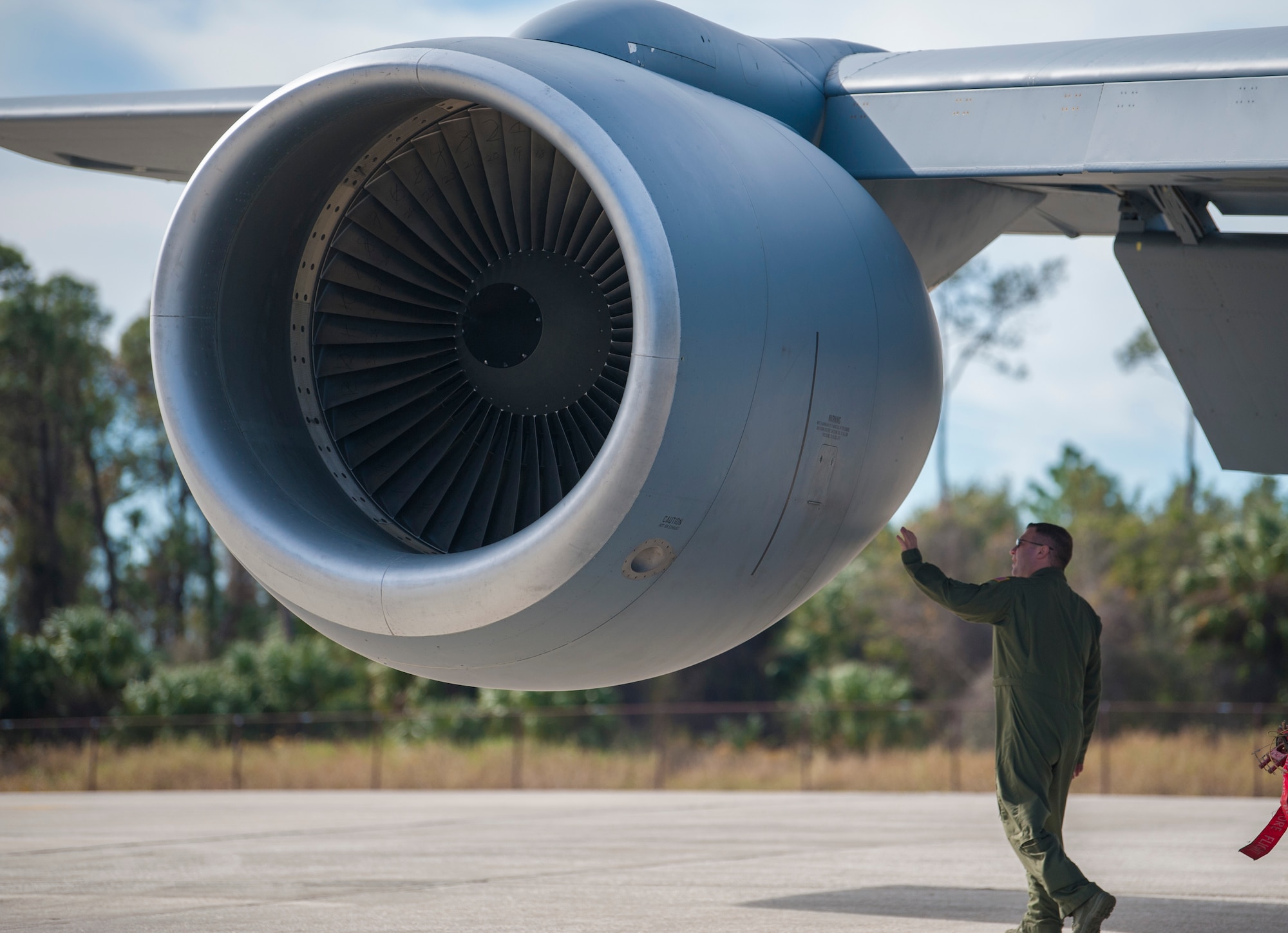U.S. Air Force Maj. Justin Fadem, director of operations assigned to the 328th Airlift Squadron from Niagara Air Reserve Station (ARS), N.Y., conducts a pre-flight inspection of a KC-135 Stratotanker aircraft at MacDill Air Force Base, Fla., Jan. 30, 2018.