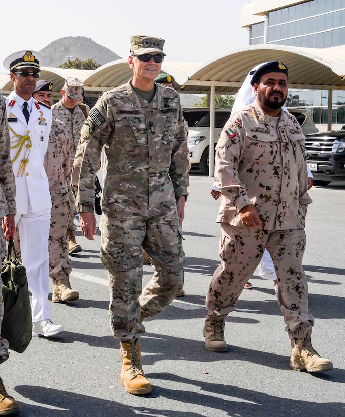 U.S. Army Gen. Joseph L. Votel, commander, U.S. Central Command, walks with officers of the armed forces of the United Arab Emirates (UAE) during exercise Native Fury 18, Jan. 24, 2018. The exercise is designed to train Marines and Sailors in Maritime Prepositioning Force operations and aimed to increase proficiency, expand levels of cooperation, enhance maritime capabilities and promote long-term regional stability and interoperability between the United Arab Emirates and the United States. (U.S. Air Force photo by Tech Sgt. Dana Flamer)