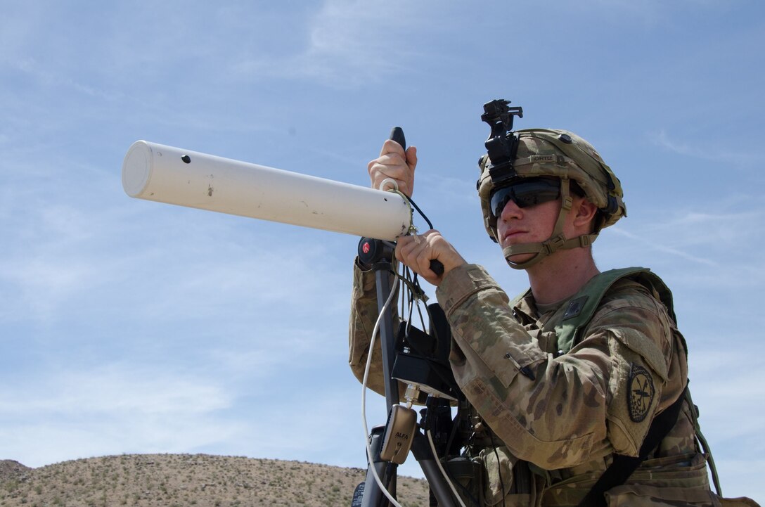 Spc. Nathaniel Ortiz, Expeditionary CEMA (Cyber Electromagnetic Activities) Team (ECT), 781st Military Intelligence Battalion, conducts cyberspace operations at the National Training Center at Fort Irwin, California, May 9.