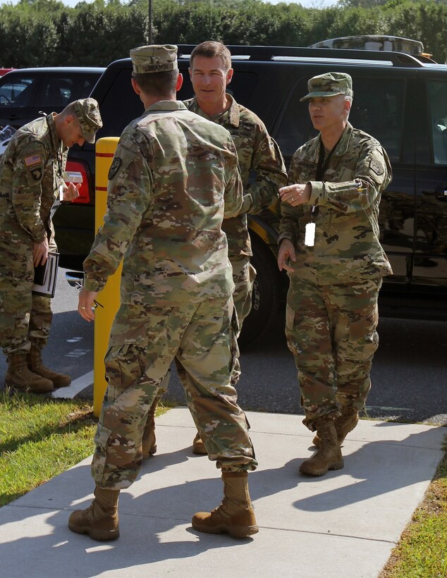 Lt. Gen. Paul Nakasone, commander, U.S. Army Cyber Command (ARCYBER) (right), introduces Gen. James McConville, Vice Chief of Staff (VCSA), U.S. Army, to Col. John “Dave” Branch, commander of the 780th Military Intelligence (MI) Brigade