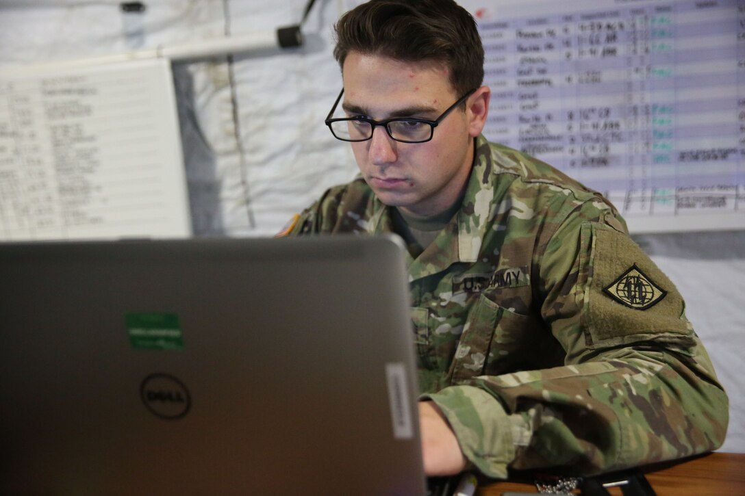 U.S. Army Sgt. Joseph Cortese, the Network Operations noncommissioned officer in charge assigned to Charlie Company, 44th Expeditionary Signal Battalion, 2nd Theater Signal Brigade, monitors the status of network and the unit's signal assemblages