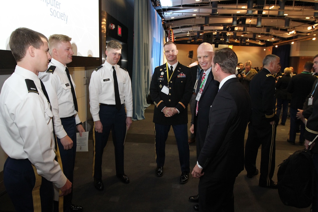 Lieutenants talk to Lt. Col. Josh Bundt, an instructor of digital forensics and research scientist with the Army Cyber Institute, United States Military Academy