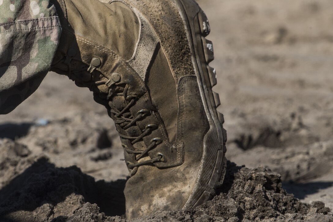 An Airman from the 824th Base Defense Squadron tries to find his footing, Jan. 24, 2018, at Camp Blanding Joint Training Center, Fla.The Airmen traveled to Blanding to participate in Weapons Week where they qualified on heavy weapons ranging from the M249 light machine gun to the M18 Claymore mine. (U.S. Air Force photo by Senior Airman Janiqua P. Robinson)