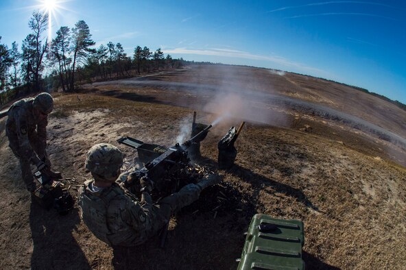 An Airman from the 824th Base Defense Squadron fires an M2 machine gun, Jan. 24, 2018, at Camp Blanding Joint Training Center, Fla.The Airmen traveled to Blanding to participate in Weapons Week where they qualified on heavy weapons ranging from the M249 light machine gun to the M18 Claymore mine. (U.S. Air Force photo by Senior Airman Janiqua P. Robinson)