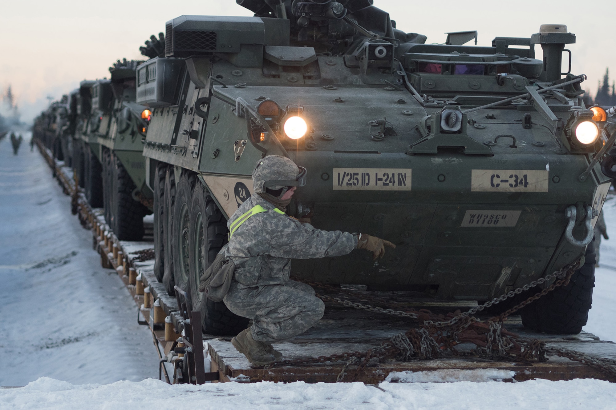 Soldiers assigned to the 1st Stryker Brigade Combat Team, 25th Infantry Division, U.S. Army Alaska, perform railhead operations in sub-zero temperatures on Joint Base Elmendorf-Richardson, Alaska, Jan. 30, 2018.  The Fort Wainwright-based Soldiers are off-loading their vehicles and equipment as part of Arctic Thrust, a short-notice rapid deployment exercise.