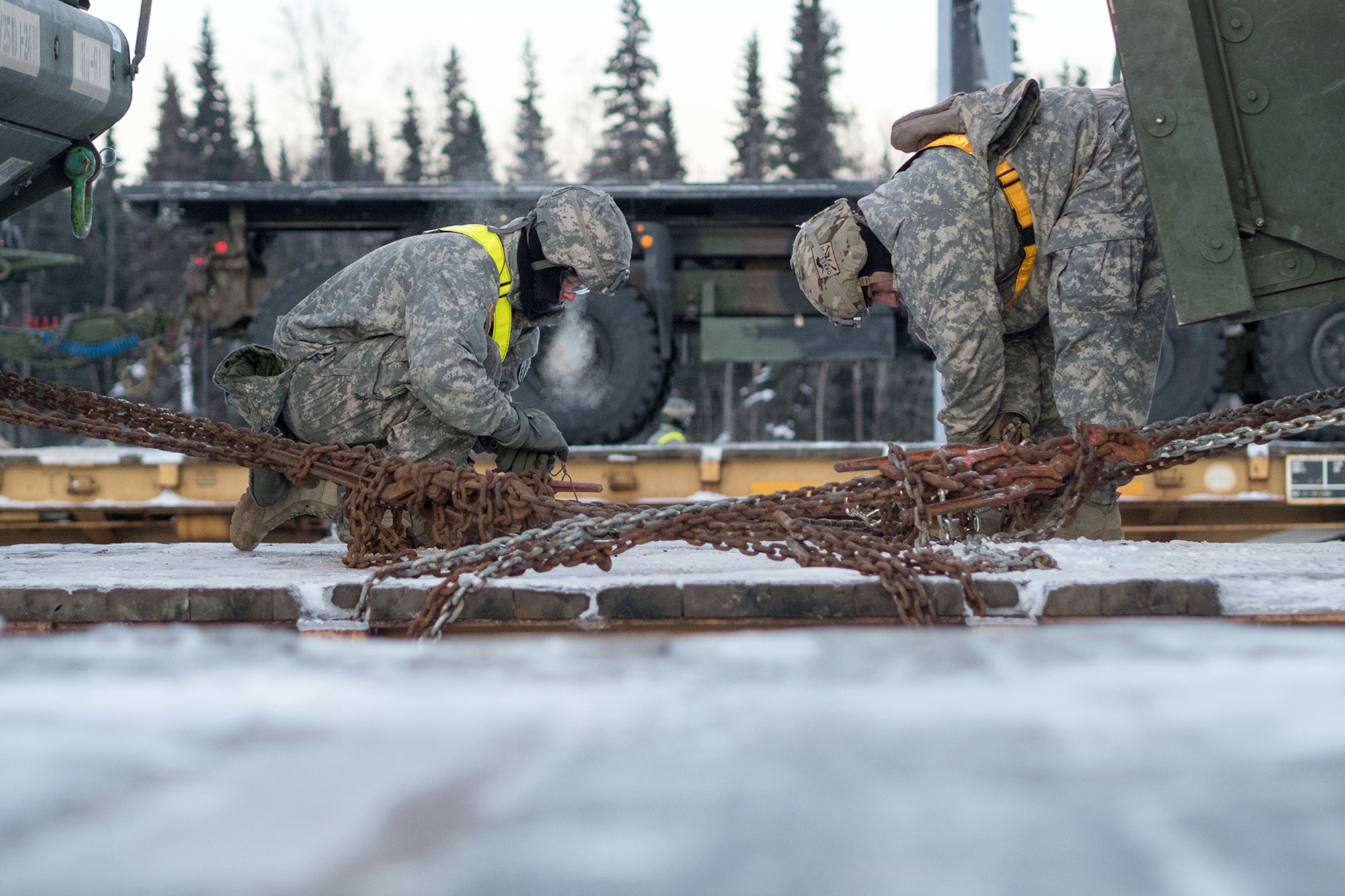 Soldiers assigned to the 1st Stryker Brigade Combat Team, 25th Infantry Division, U.S. Army Alaska, perform railhead operations in sub-zero temperatures on Joint Base Elmendorf-Richardson, Alaska, Jan. 30, 2018.  The Fort Wainwright-based Soldiers are off-loading their vehicles and equipment as part of Arctic Thrust, a short-notice rapid deployment exercise.