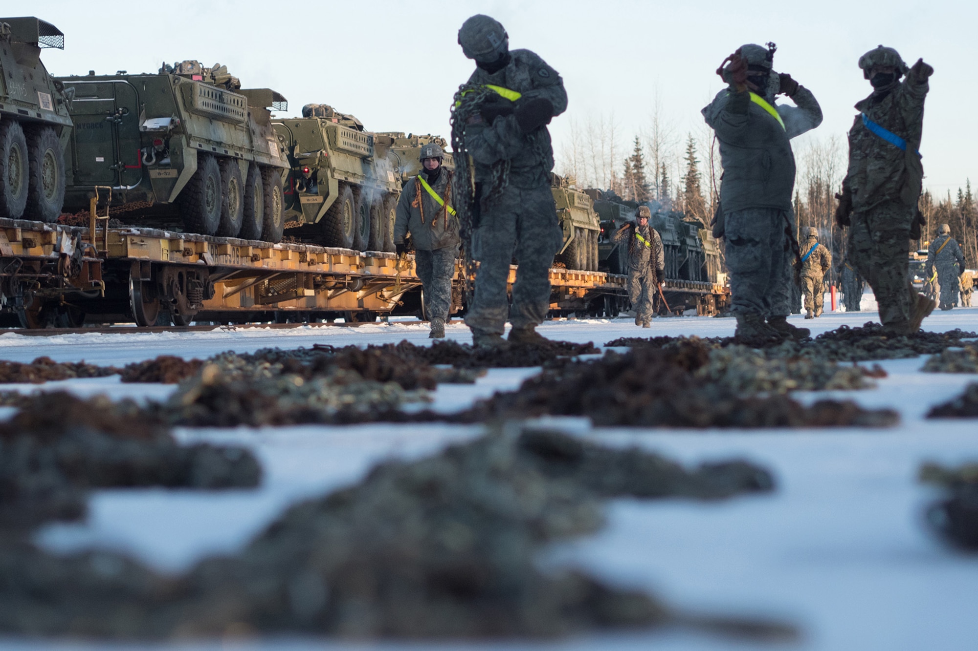 Soldiers assigned to the 1st Stryker Brigade Combat Team, 25th Infantry Division, U.S. Army Alaska, perform railhead operations in sub-zero temperatures on Joint Base Elmendorf-Richardson, Alaska, Jan. 30, 2018.  The Fort Wainwright-based Soldiers are off-loading their vehicles and equipment as part of Arctic Thrust, a short-notice rapid deployment exercise.