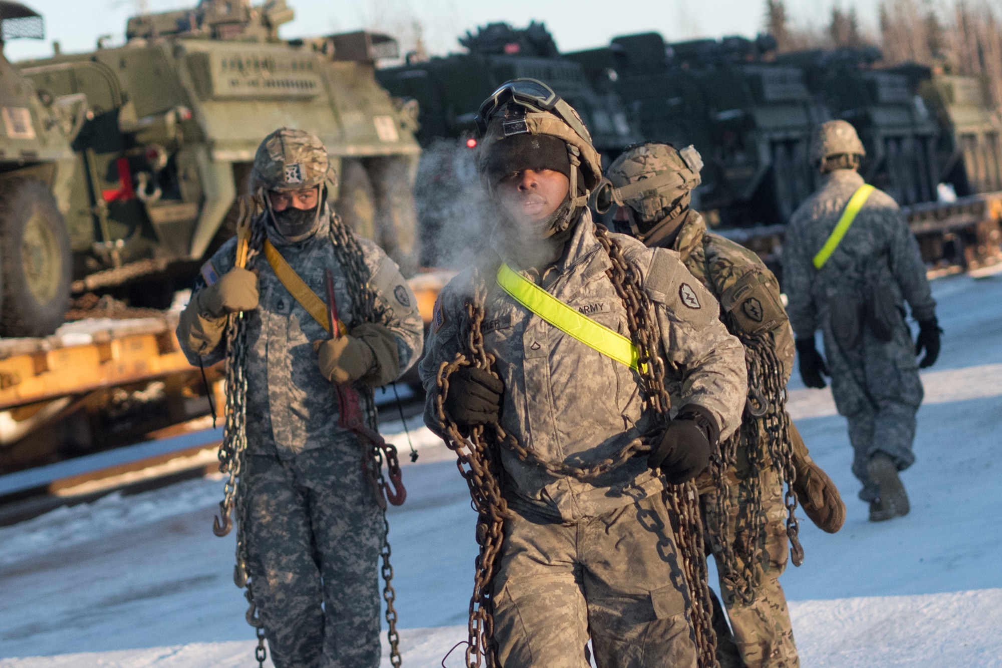 Soldiers assigned to the 1st Stryker Brigade Combat Team, 25th Infantry Division, U.S. Army Alaska, perform railhead operations in sub-zero temperatures on Joint Base Elmendorf-Richardson, Alaska, Jan. 30, 2018.  The Fort Wainwright-based Soldiers are off-loading their vehicles and equipment as part of Arctic Thrust, a short-notice rapid deployment exercise.