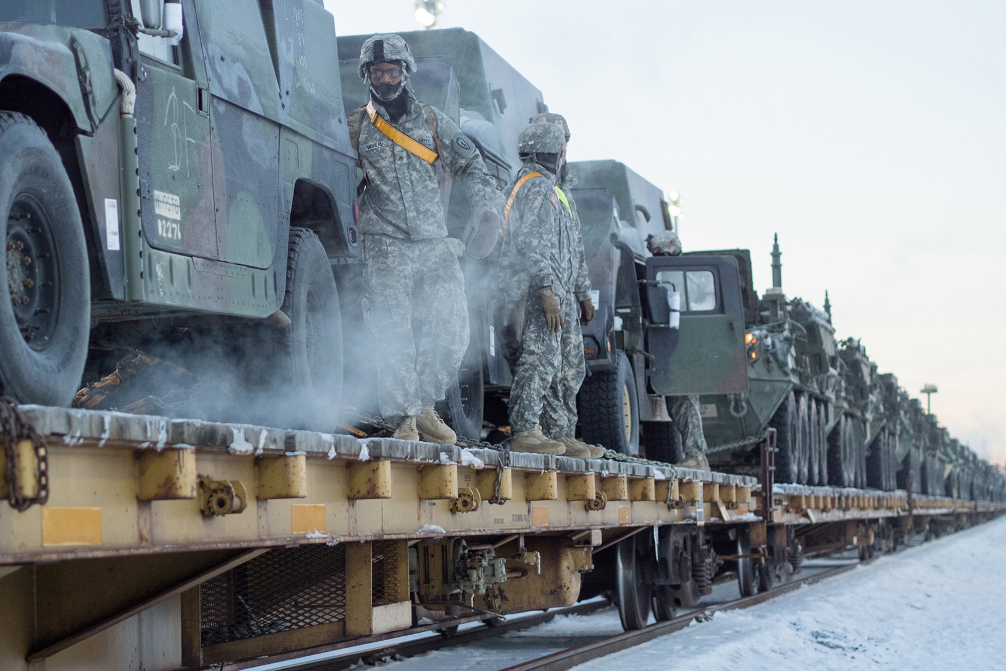 Soldiers assigned to the 1st Stryker Brigade Combat Team, 25th Infantry Division, U.S. Army Alaska, perform railhead operations in sub-zero temperatures on Joint Base Elmendorf-Richardson, Alaska, Jan. 30, 2018.  The Fort Wainwright-based Soldiers are off-loading their vehicles and equipment as part of Arctic Thrust, a short-notice rapid deployment exercise.