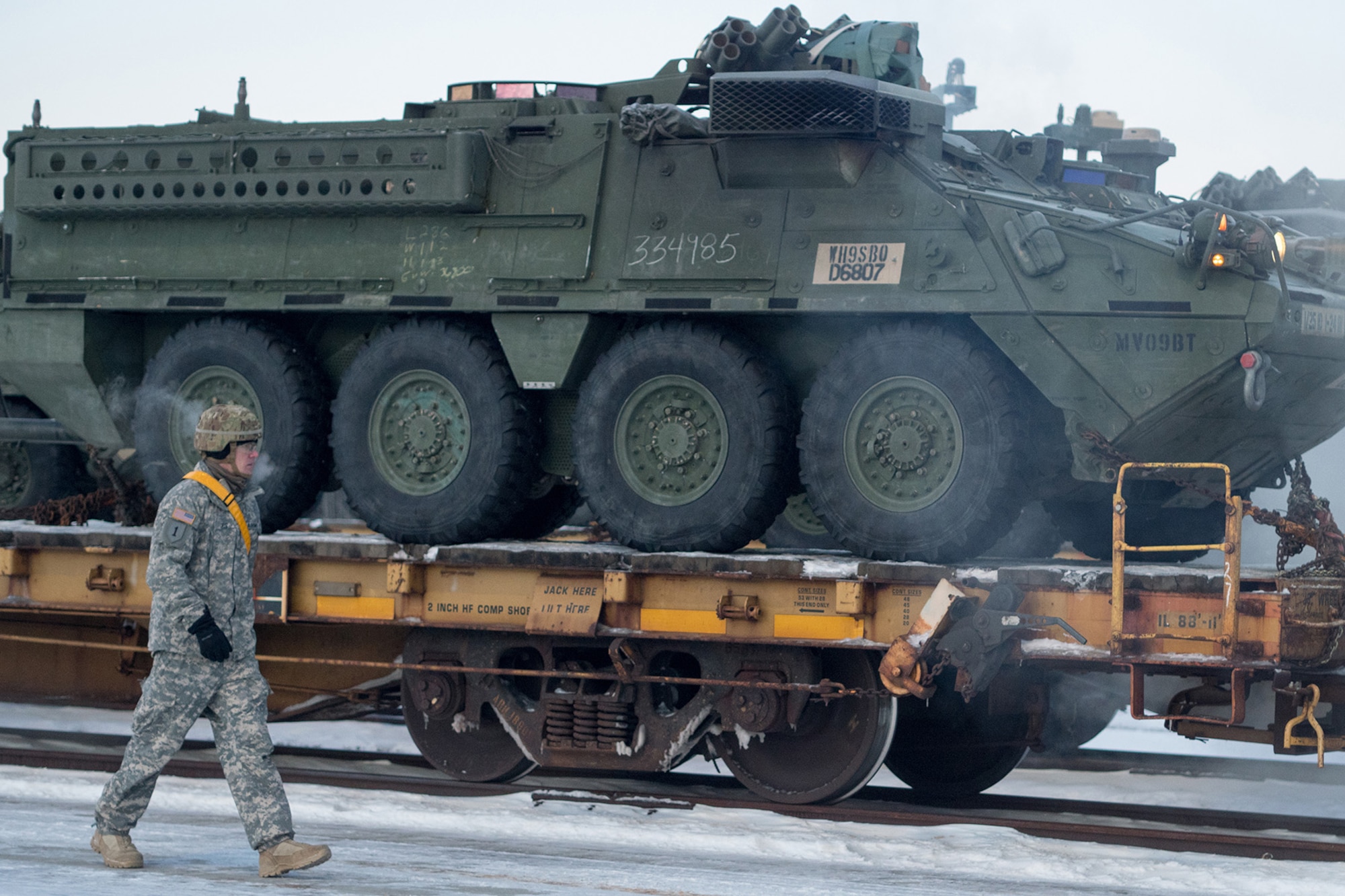 Soldiers assigned to the 1st Stryker Brigade Combat Team, 25th Infantry Division, U.S. Army Alaska, perform railhead operations in sub-zero temperatures on Joint Base Elmendorf-Richardson, Alaska, Jan. 30, 2018.  The Fort Wainwright-based Soldiers are off-loading their vehicles and equipment as part of Arctic Thrust, a short-notice rapid deployment exercise.