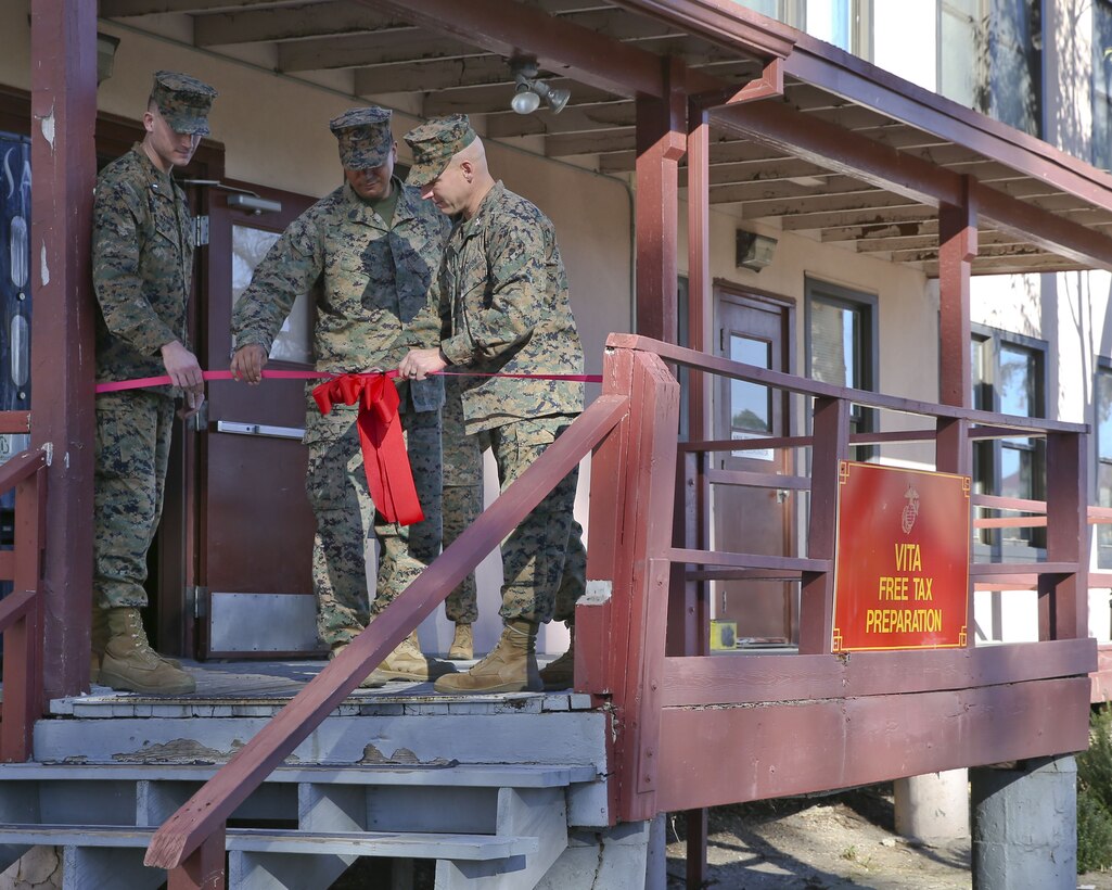 U.S Marine Corps Colonel John R. Polidoro, prepares to cut the ribbon to symbolize the grand opening of the tax center aboard Camp Pendleton, Calif., Jan. 29, 2018. The volunteer income tax assistance center offers active duty members, dependents, veterans, and Department of Defense members, free tax services, from Jan. 29th till May 1st. (U.S, Marine Corps photo by Cpl. Anabel Abreu Rodriguez)