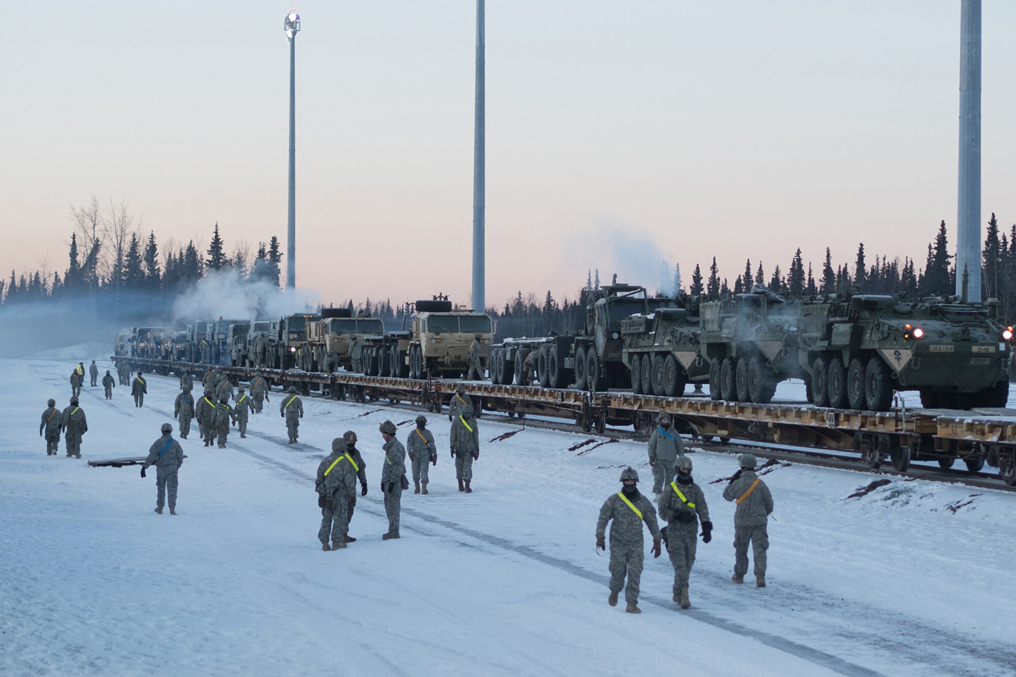 Soldiers assigned to the 1st Stryker Brigade Combat Team, 25th Infantry Division, U.S. Army Alaska, perform railhead operations in sub-zero temperatures on Joint Base Elmendorf-Richardson, Alaska, Jan. 30, 2018.  The Fort Wainwright-based Soldiers are off-loading their vehicles and equipment as part of Arctic Thrust, a short-notice rapid deployment exercise.