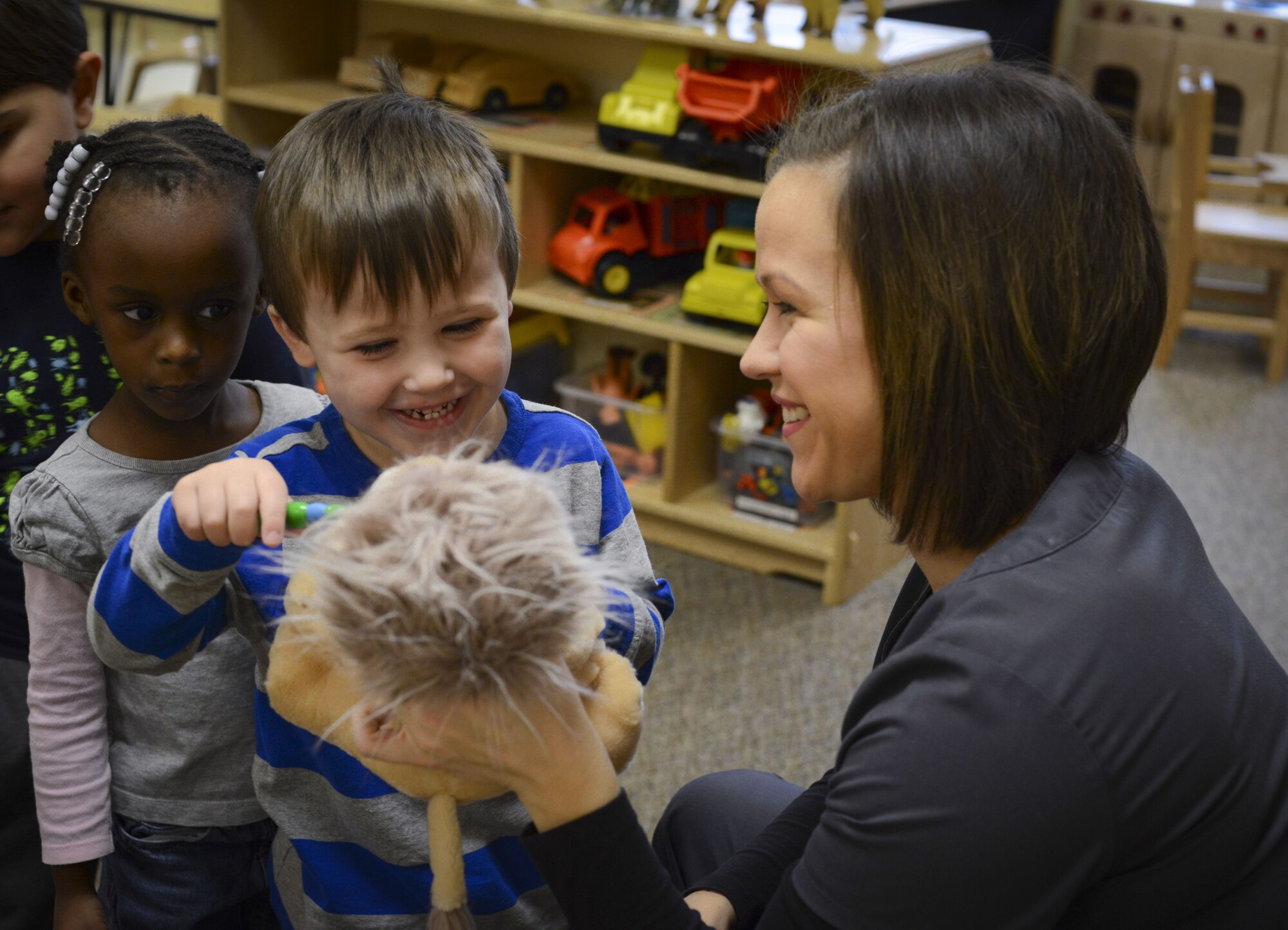 Gabe, son of Jessica Puffenbarger, 23d Areospace Medicine Squadron dental assistant, practices brushing teeth on a doll, Feb. 1, 2018, at Moody Air Force Base, Ga. Dental assistants from the 23d AMDS visited the Child Development Center as part of National Children’s Dental Health Month, to teach children the importance of proper oral care and good habits for taking care of their teeth. (U.S. Air Force photo by Senior Airman Lauren M. Sprunk)