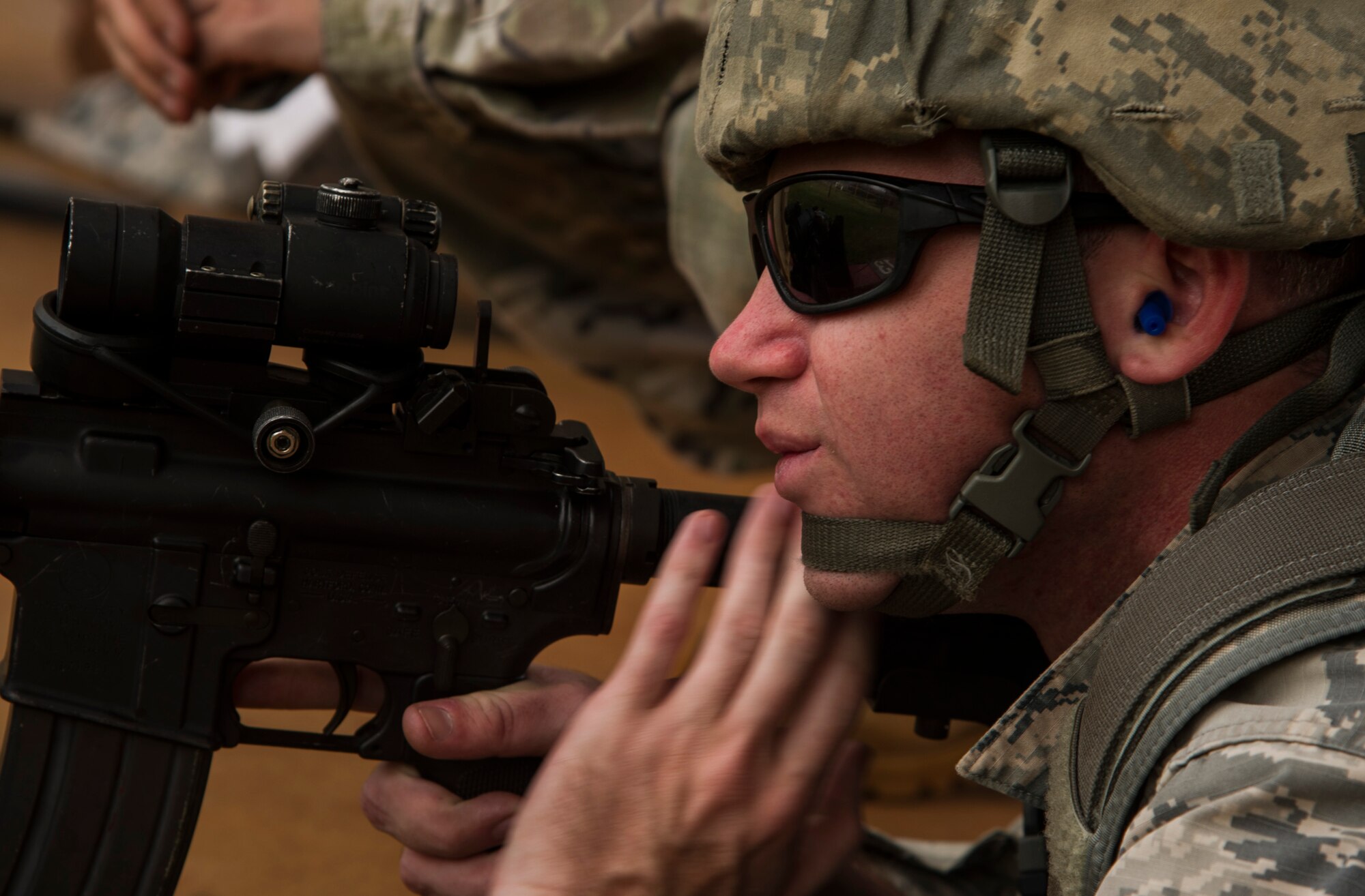 Senior Airman Justin Bartels, Joint Base Security defender, practices shooting with an M4 carbine at the combat arms training and maintenance range at Scofield Barracks, Hawaii, Jan. 30, 2019. At the range, Airmen familiarize themselves with the weapons they use while deployed. (U.S. Air Force photo by Tech. Sgt. Heather Redman)