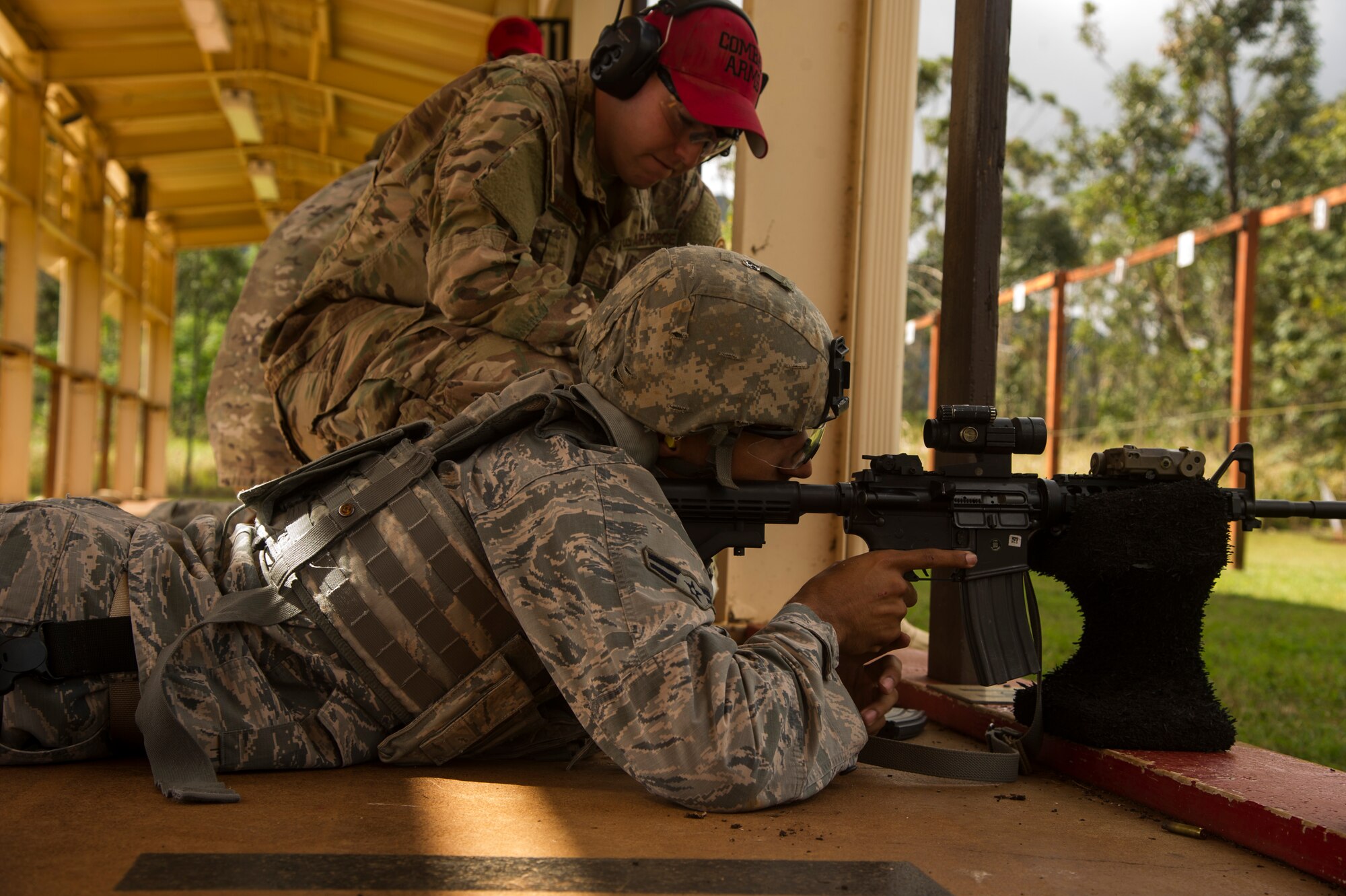 Airman 1st Class William Wilson, Joint Base Security defender, practices shooting with an M4 carbine at the combat arms training and maintenance range at Scofield Barracks, Hawaii, Jan. 30, 2019. At the range, Airmen familiarize themselves with the weapons they use while deployed. (U.S. Air Force photo by Tech. Sgt. Heather Redman)