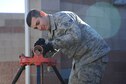 U.S. Air Force Senior Airman Andres Macias, 355th Civil Engineer Squadron HVAC journeyman, reams a copper pipe for a chiller at Davis-Monthan Air Force Base, Ariz., Jan. 31, 2018.