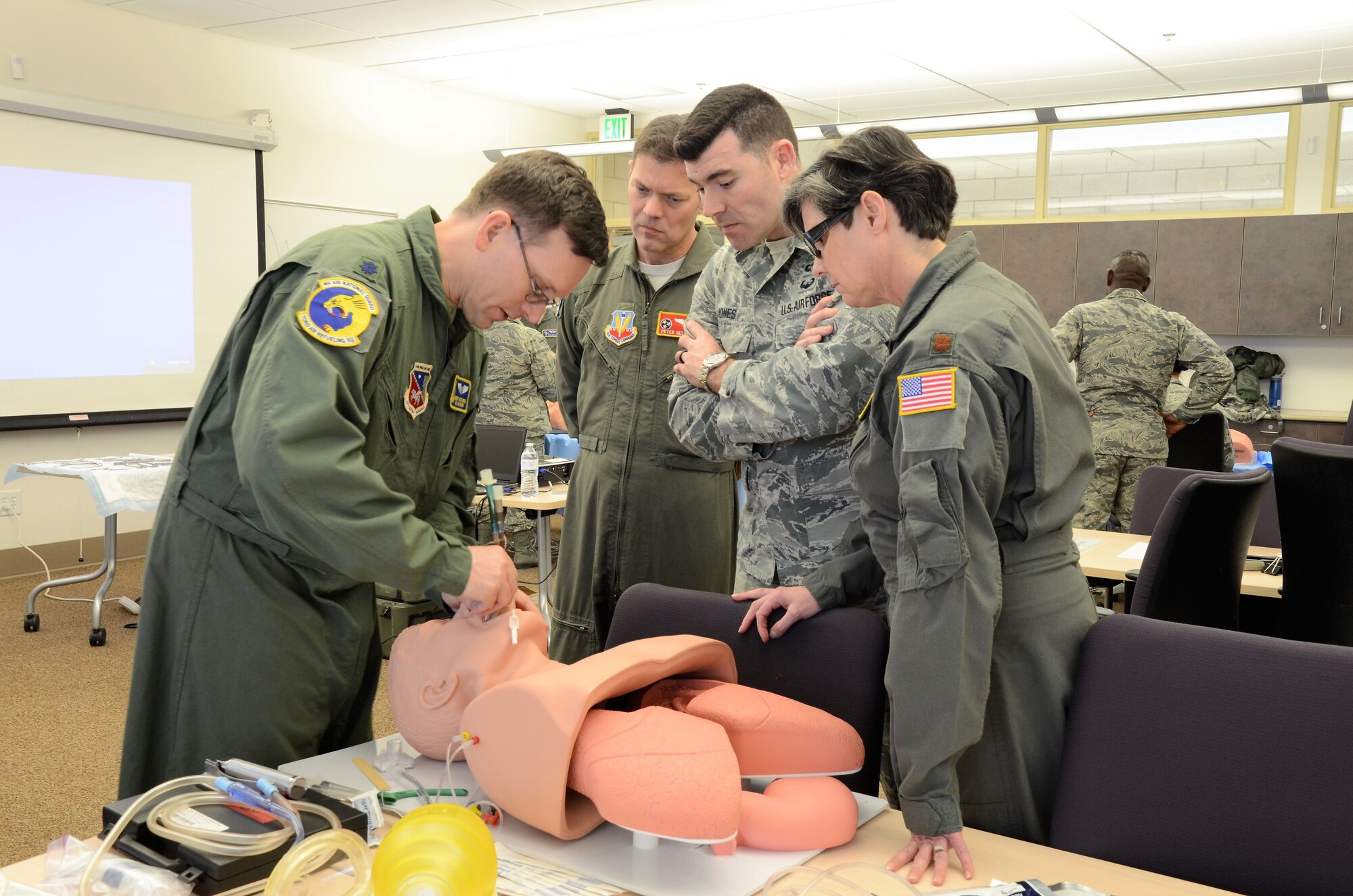 U.S. Air Force Lt. Col. Robert Piotroski, flight Surgeon, 133rd Air Refueling Squadron, Pease ANGB, New Hampshire, demonstrates an advanced airway breathing procedure to class members during a training exercise at Nellis AFB, Las Vegas  Jan. 26 to Feb. 2, 2018 (Georgia Air National Guard photo by Tech. Sgt. Keri Giles)