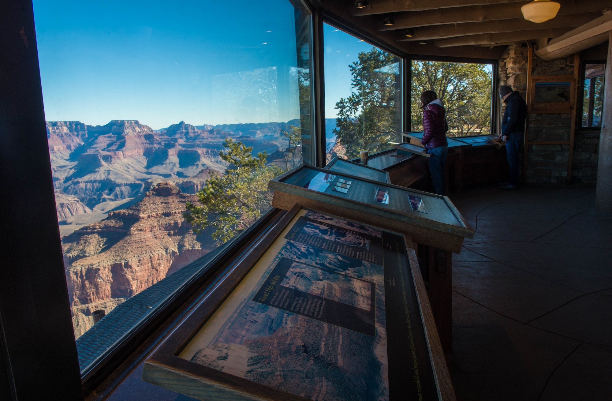 Visitors interact with various maps and documentation in the Yavapi Point Geology Museum in Grand Canyon National Park, Ariz., Jan. 27, 2018. Grand Canyon National Park offers a multitude of educational and historical opportunities for Airmen stationed at Luke Air Force Base to learn about southwest heritage and culture. (U.S. Air Force photo/Airman 1st Class Caleb Worpel)