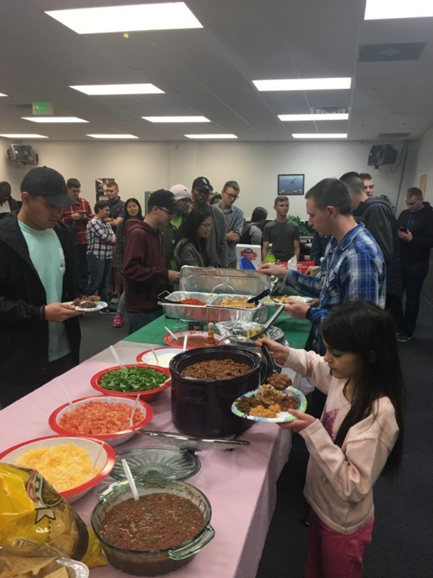 Airmen from the First Term Airmen's Center and their families enjoy a home-cooked meal with Hill Air Force Base leaders at the Junior Enlisted Recreation Center Jan. 31, 2018. The dinners provides first-term Airmen and their families an opportunity to mingle with leadership and make valuable contacts. (Courtesy photo)