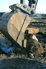 A British Army excavator removes a slab of concrete that was broken up from a demolished pad on a disused airfield at Rock Barracks, Woodbridge, England, Jan. 25, 2018. U.S. Airmen from the 100th Civil Engineer Squadron pavements and equipment flight spent a week working alongside British Army engineers from the 23 Parachute Engineer Regiment, training their NATO partners in airfield damage repair. The Airmen and soldiers each had the opportunity to use each other’s heavy equipment and working practices. (U.S. Air Force photo by Karen Abeyasekere)