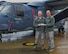 Chaplain (Lt. Col.) Ronald Ragon and Chaplain (Capt.) Joseph Wright, 100th Air Refueling Wing chaplains, stand in front of CV-22 holding a McCallie School bumper sticker on Dec. 21, 2017 on RAF Mildenhall, England. (U.S. Army photo by Staff Sgt. Philip Steiner )