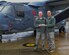 Chaplain (Lt. Col.) Ronald Ragon and Chaplain (Capt.) Joseph Wright, 100th Air Refueling Wing chaplains, stand in front of CV-22 holding a McCallie School bumper sticker on Dec. 21, 2017 on RAF Mildenhall, England. (U.S. Army photo by Staff Sgt. Philip Steiner )