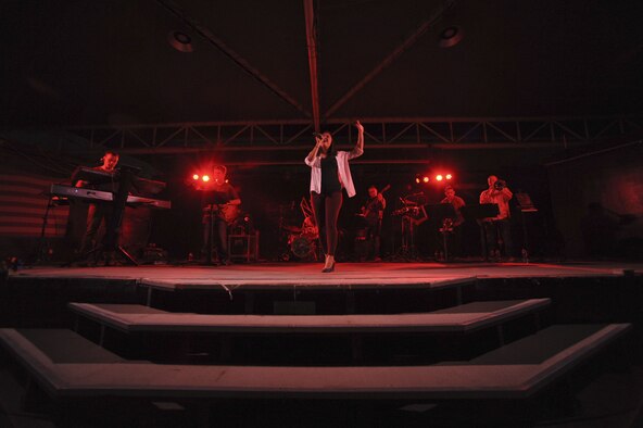 U.S. Air Force Airman 1st Class Danielle Diaz, a vocalist with the AFCENT band, performs at the community activity center on Al Dhafra Air Base, United Arab Emirates, Jan. 26, 2018. The bands provide the power of music to inspire immediate, positive and long-lasting impressions of the U.S. Air Force and the United States in the hearts and minds of audiences worldwide. (U.S. Air Force photo by Airman 1st Class D. Blake Browning)