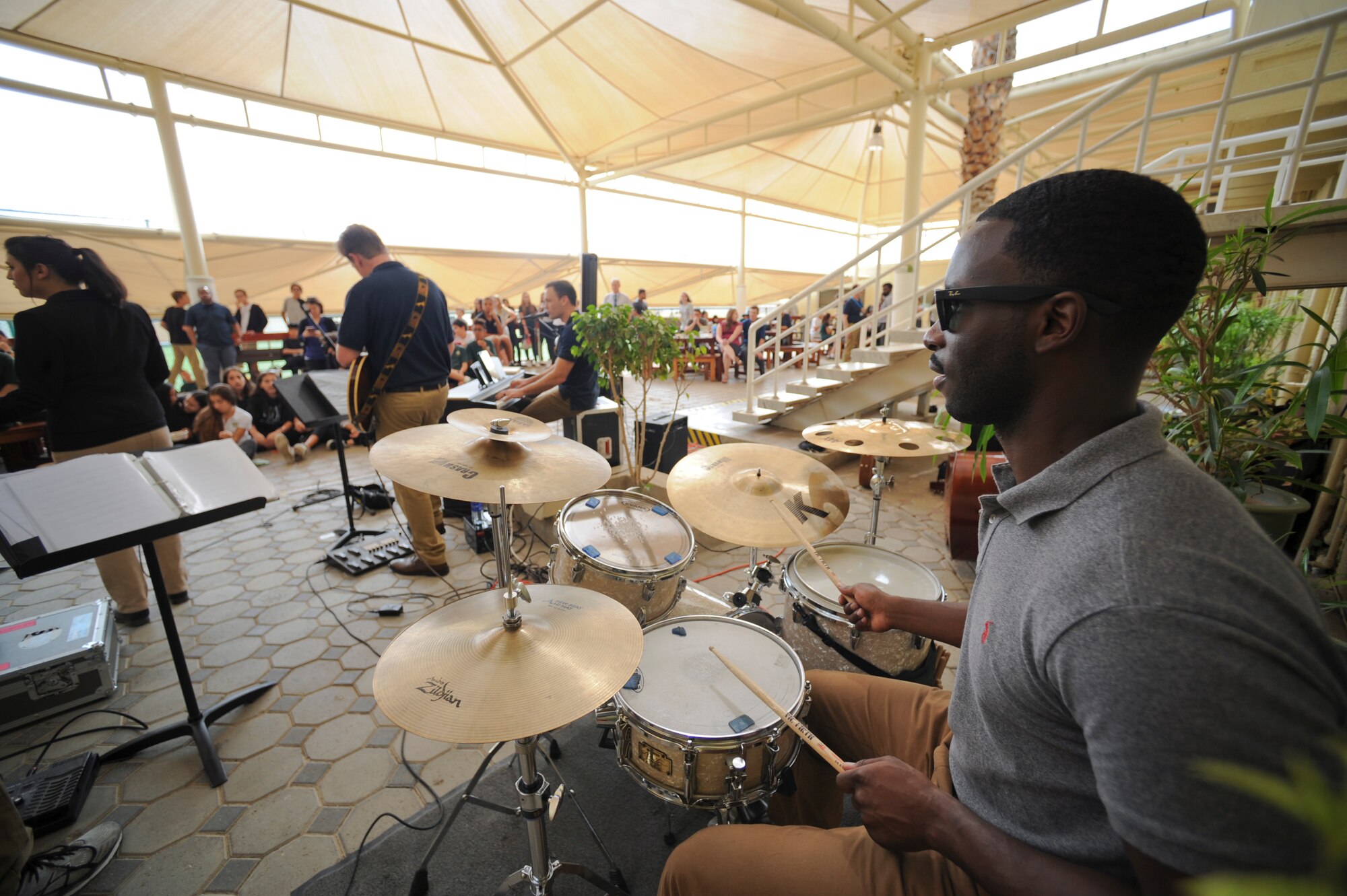 U.S. Air Force Staff Sgt. Quincy Brown, a drummer with the AFCENT band, performs at a school within the United Arab Emirates, Jan. 28, 2018. Using music to bridge language, cultural, societal and socio-economic differences, the bands play a key role in increasing public understanding of the importance of airpower, the mission, policies, and programs of the Air Force and the bravery, sacrifice and dedication of Airmen. (U.S. Air Force photo by Airman 1st Class D. Blake Browning)