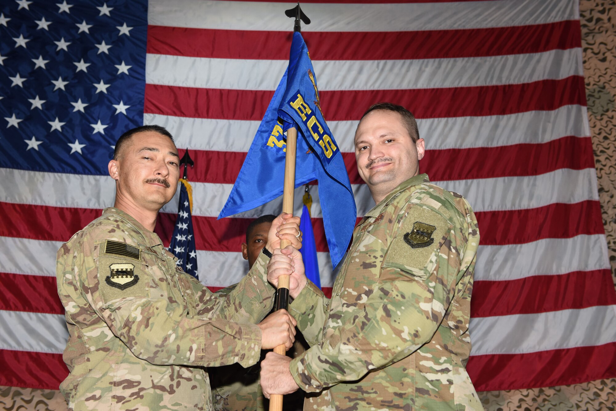 Lt. Col. Richard Sharpe assumes command of the 332d Expeditionary Communications Squadron from Col. Christopher Fuller, 332nd Expeditionary Mission Support Group commander, January 24, 2018 in Southwest Asia