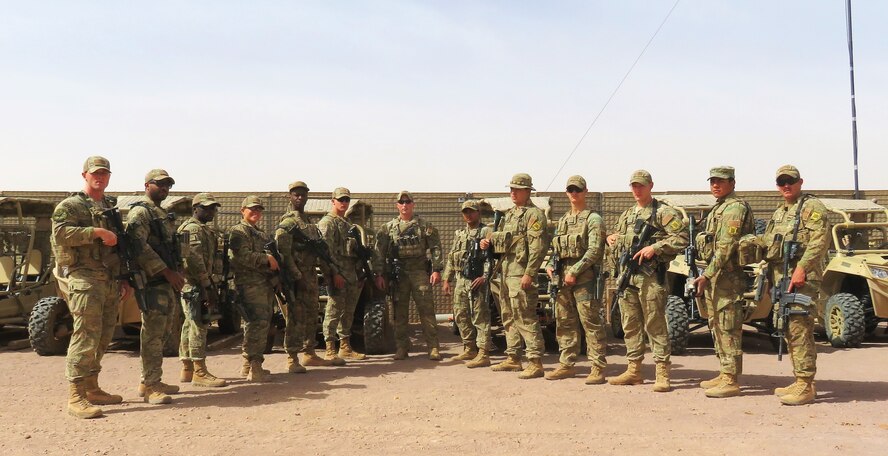 U.S. Air Force Airmen from the 822nd Expeditionary Base Defense Squadron pose for a photograph on Feb. 2, 2018 at Air Base 201, Niger. The team recently worked alongside local military members to rescue a two-year-old girl, after being notified by local villagers that she was lost near the base on Jan. 18, 2018.  The Airmen not only showcased their capabilities that night, but also demonstrated the U.S. Air Force’s effectiveness in working alongside host nation security forces to build interoperability as a team. (U.S. Air Force courtesy photo)