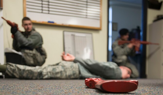 Makarenko and Greene apprehended Crawford, but could not move him until the entire building was secured.