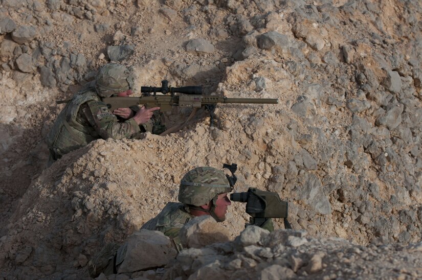 Specialist Nathan Goodlet and Cpl. Jacob Kehler, snipers with Headquarters and Headquarters Company, 1st Battalion, 6th Infantry Regiment, 2nd Armored Brigade Combat Team, 1st Armored Division, search for a simulated enemy high-value target, Jan 29. 2018, during Inferno Creek 2018 near Thumrait, Oman. Inferno Creek 2018 is an annual Omani-U.S. exercise focused on building bilateral ties between the two militaries. This is the first time the exercise was held at the company level.