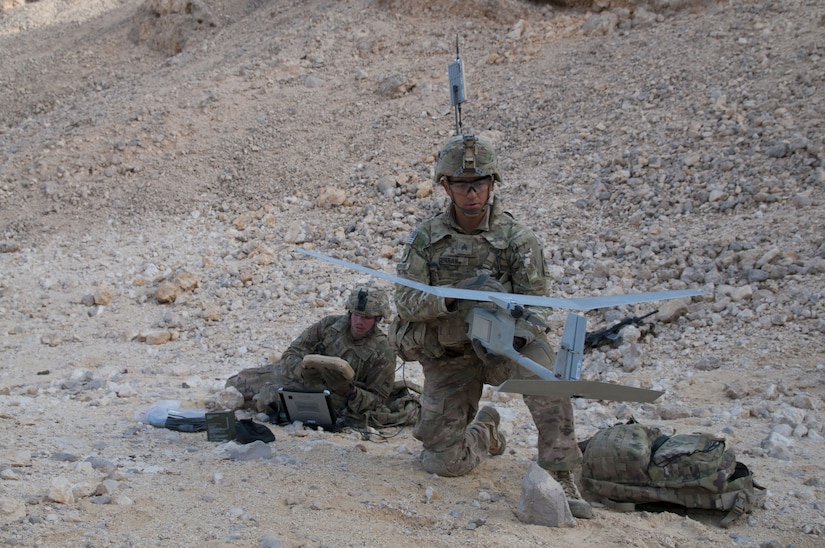 Sergeant Daniel Serrano and Pfc. James White, cavalry scouts with Headquarters and Headquarters Company, 1st Battalion, 6th Infantry Regiment, 2nd Armored Brigade Combat Team, 1st Armored Division, test a Raven unmanned aerial vehicle prior to its flight, Jan 28. 2018, during Inferno Creek 2018 near Thumrait, Oman. The Raven team reported obstacles and enemy movements to the infantry commander on the ground during the exercise. Inferno Creek 2018 is an annual Omani-U.S. exercise focused on building bilateral ties between the two militaries. This is the first time the exercise was held at the company level.