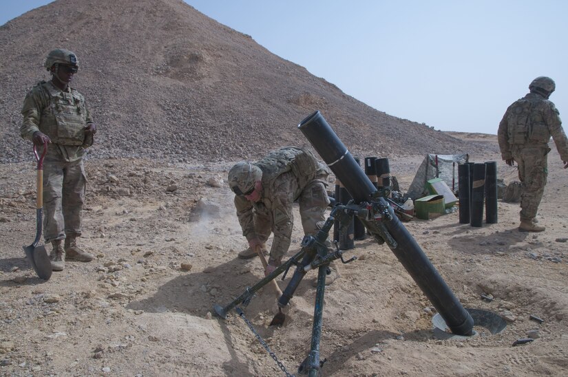 Corporal Ryan Bachman, a squad leader and mortarman with Headquarters and Headquarters Company, 1st Battalion, 35th Armored Regiment, 2nd Armored Brigade Combat Team, 1st Infantry Division, helps dig out the mortar pit, Jan 29. 2018, during Inferno Creek 2018 near Thumrait, Oman. Inferno Creek 2018 is an annual Omani-U.S. exercise focused on building bilateral ties between the two militaries. This is the first time the exercise was held at the company level.