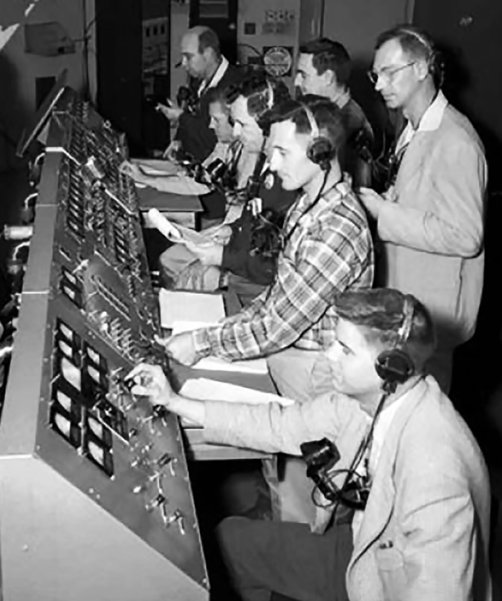 Technicians and engineers monitor the countdown for the liftoff of Explorer 1 in the control room of the blockhouse at Space Launch Complex 26 at the Cape Canaveral Missile Annex (now Cape Canaveral Air Force Station). (Courtesy photo by NASA)