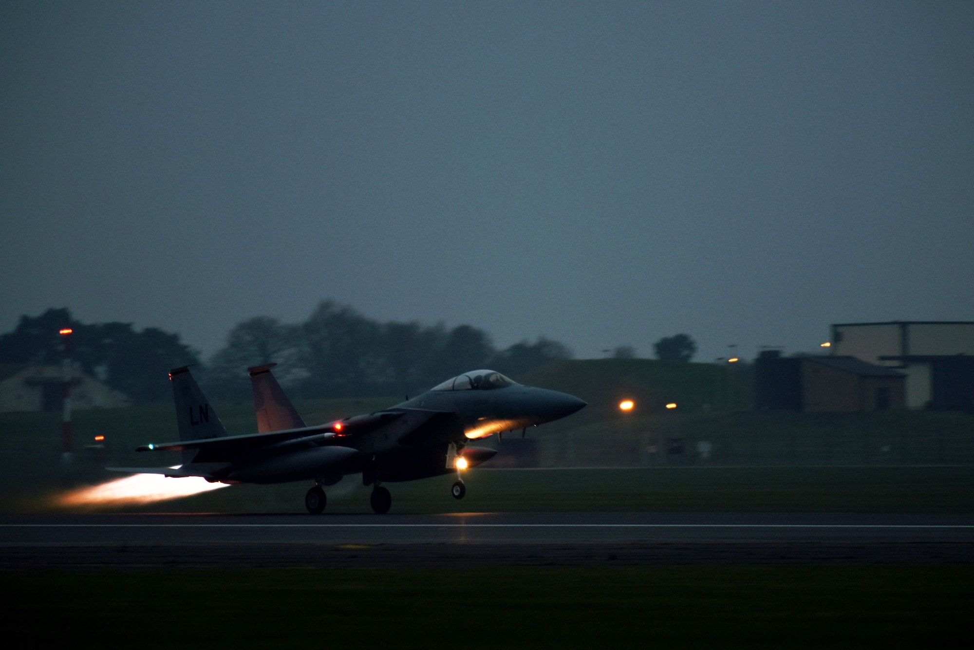 A 493rd Fighter Squadron F-15C Eagle takes off at Royal Air Force Lakenheath, England, Jan. 9. Communication security Airmen are responsible for maintaining the encryption keys used by pilots for secure communications.  (U.S. Air Force photo/Senior Airman Abby L. Finkel)