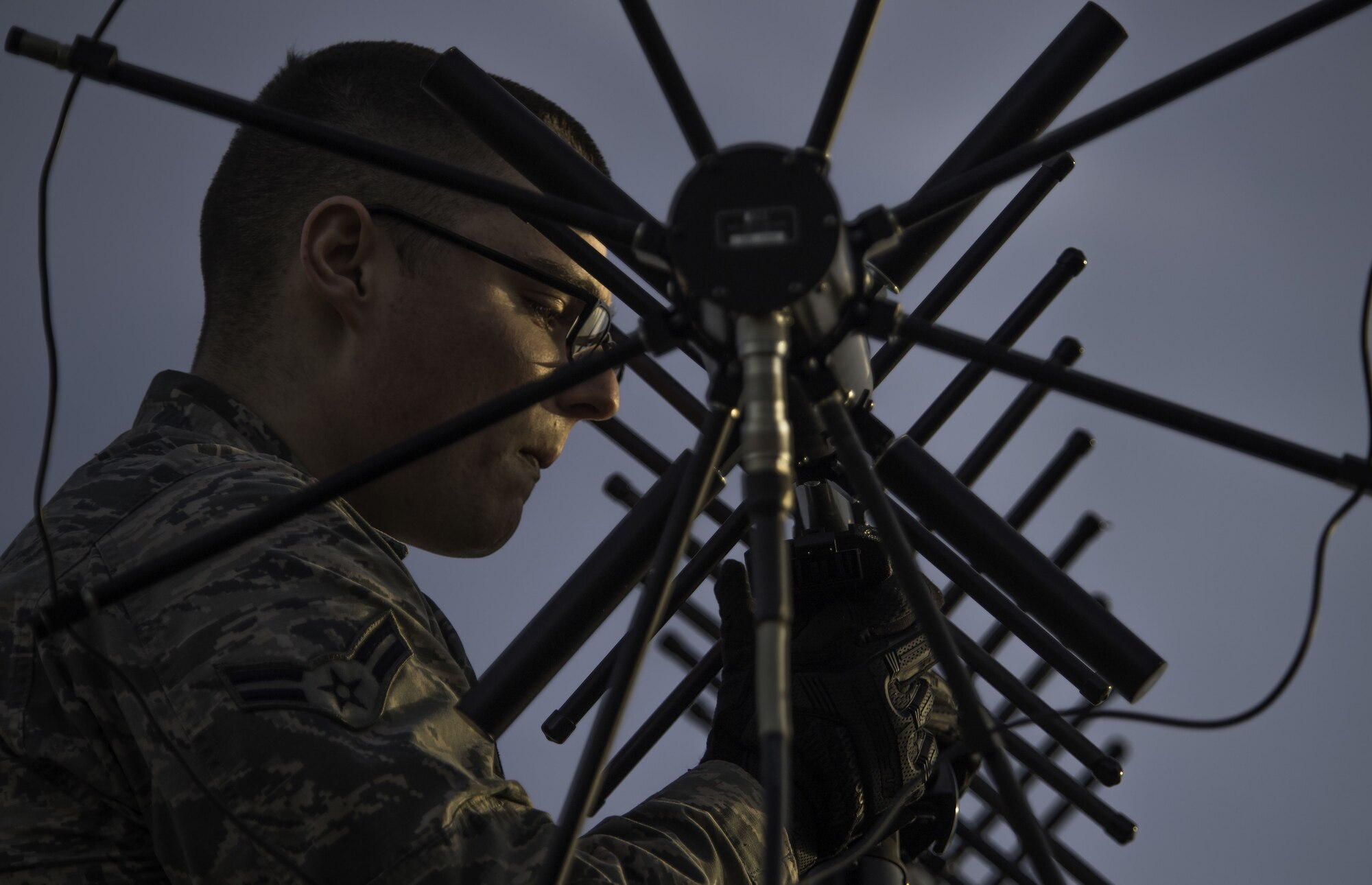 Airman 1st Class Colin Martin, 5th Communications Squadron radio frequency transport system apprentice, adjusts an antenna in support of a strategic bomber deployment at RAF Fairford, England, Jan. 10, 2018. The deployment of strategic bombers to the United Kingdom helps exercise U.S. Air Forces in Europe's forward operating location for bombers. Training with joint partners, allied nations and other U.S. Air Force units help the 5th Bomb Wing contribute to ready and postured forces. (U.S. Air Force photo by Staff Sgt. Trevor T. McBride)