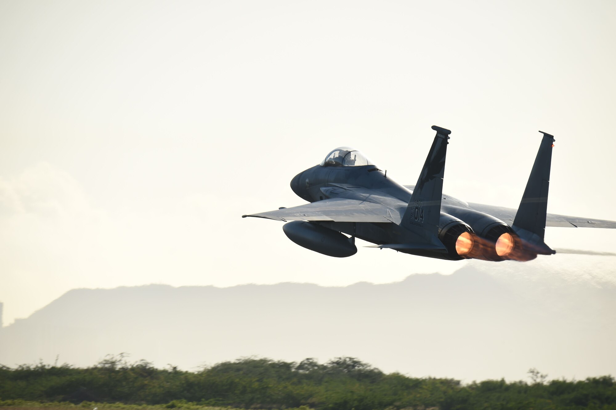 An F-15 Eagle fighter jet from California Air National Guard’s 144th Fighter Wing takes-off for the morning launch during Sentry Aloha 18-01 Jan. 12, 2017, at Joint Base Pearl Harbor-Hickam, Hawaii. Sentry Aloha provides tailored, cost effective and realistic combat training for the Air Force, Air National Guard and other Department of Defense services to provide warfighters with the skill sets necessary to perform their homeland defense and overseas combat missions. (U.S. Air National Guard photo by Senior Master Sgt. Chris Drudge)