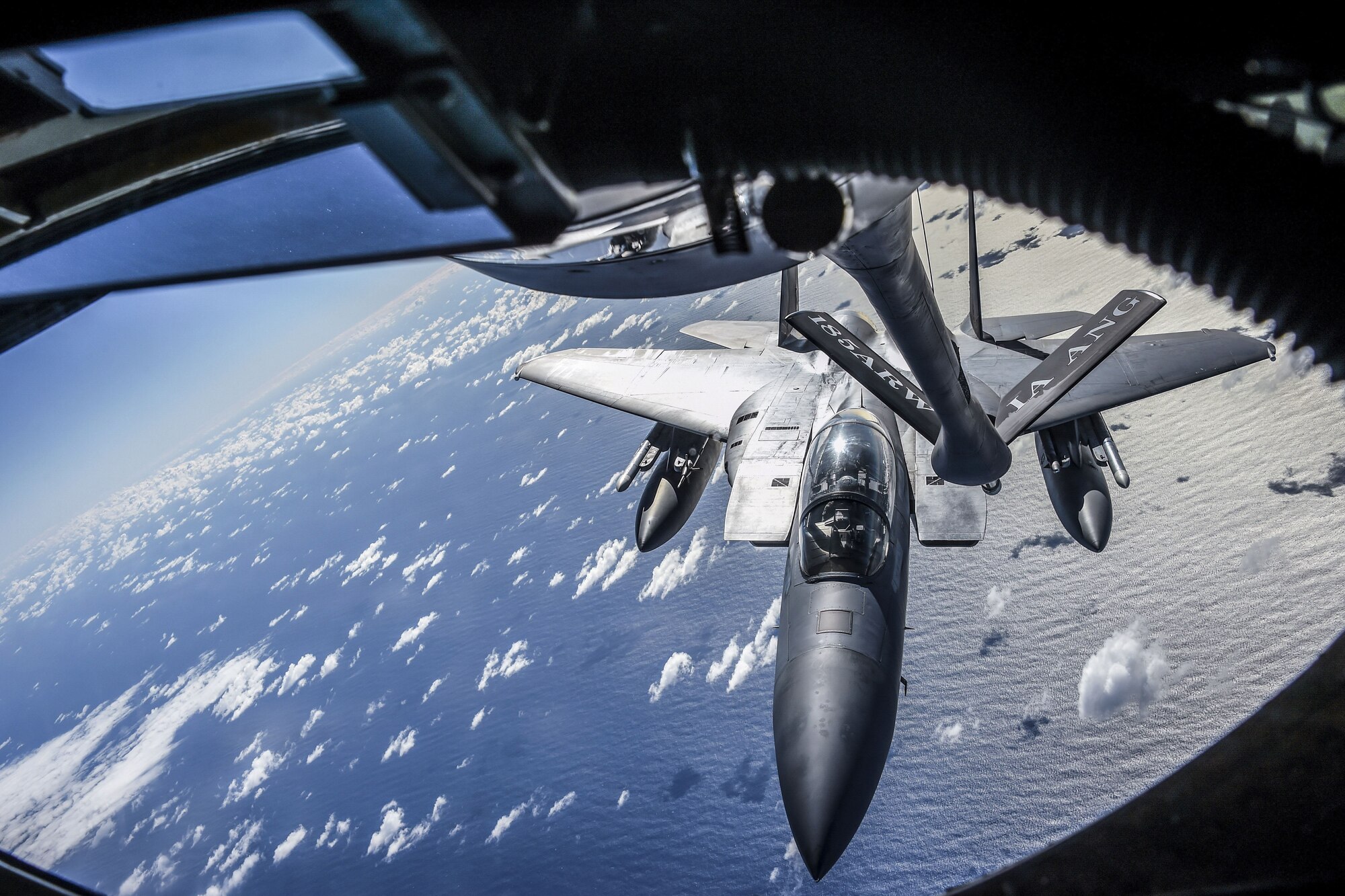 A U.S. Air Force F-15 Eagle from California Air National Guard’s 144th Fighter Wing approaches the boom of a KC-135 Stratotanker from Iowa ANG’s 185th Air Refueling Wing during Sentry Aloha 18-01 above Joint Base Pearl Harbor-Hickam, Hawaii Jan. 17, 2018. Sentry Aloha provides tailored, cost effective and realistic combat training for U.S. Air Force, Air National Guard and other Department of Defense services to provide U.S. warfighters with the skill sets necessary to perform their homeland defense and overseas combat missions. (Air National Guard photo by Senior Master Sgt. Chris Drudge)