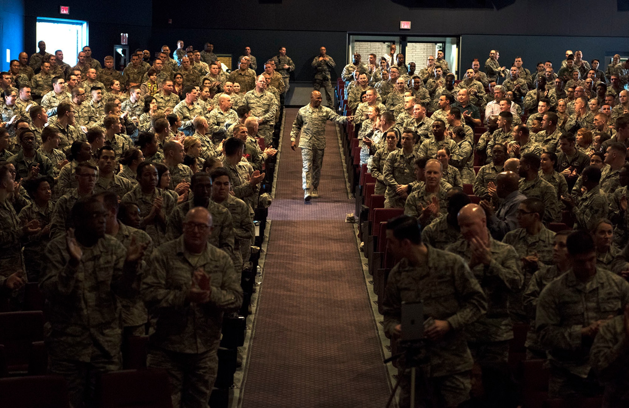 Chief Master Sgt. of the Air Force Kaleth O. Wright, makes his way down an aisle at the Sheppard Air Force Base, Texas, base theater during an "all call" assembly, Jan. 25, 2018. The CMSAF addressed issues that affect the lives of Airmen daily and also heard questions and concerns from some of those in attendance. (U.S. Air Force photo by Alan R. Quevy)