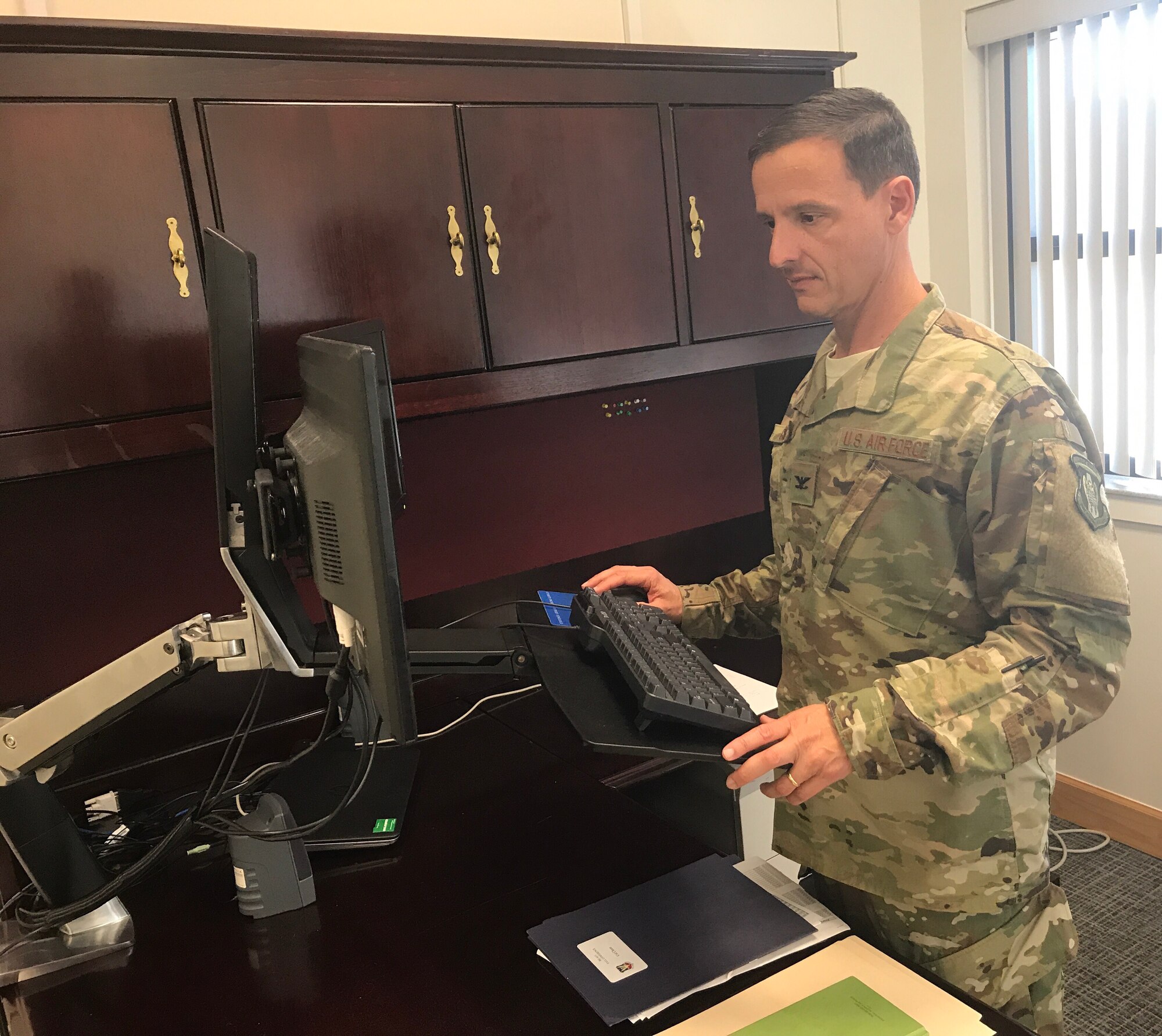 Col. Ian Chase, 920th Rescue Wing vice commander, works from his desk at Patrick AFB, Dec. 3, 2017. Chase joined the combat search and rescue reserve unit Aug. 5, 2017 and brings with him many years of experience as a navigator. In the past, Chase has been assigned to several special operations units including the 711th Special Operations Squadron, Duke Field, Florida. (U.S. Air Force photo by Senior Airman Brandon Kalloo Sanes)
