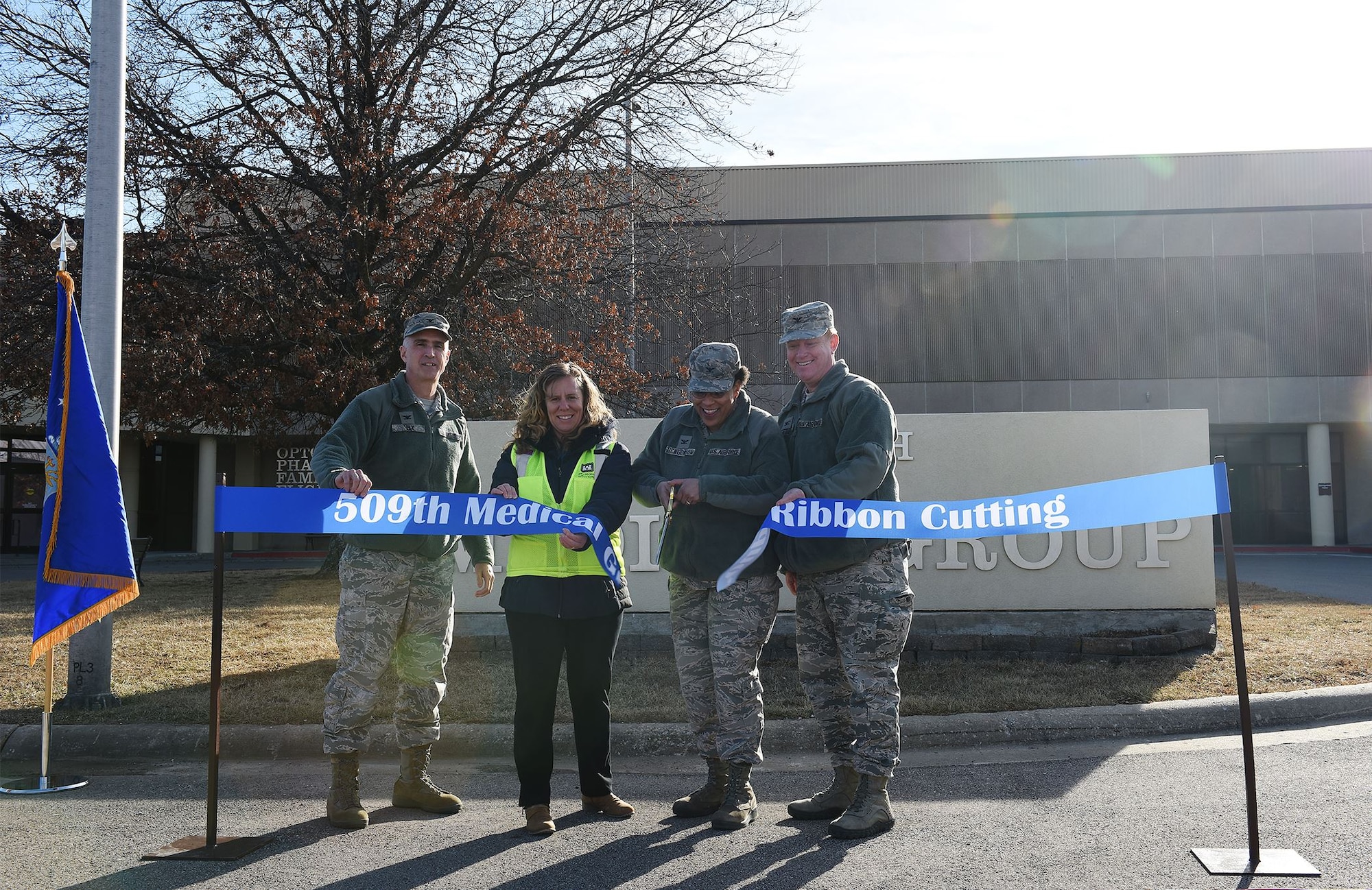 Leadership cutting the 509th Medical Group's ribbon.