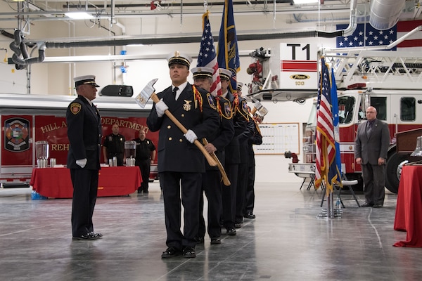 Firefighters in formation during the ceremony to formally open Hill's new flight line fire station. The station will improve response times and the quality of life for the firefighters who live and work there. The $14 million facility will house 45 firefighters and has enough space for 16 vehicles.
