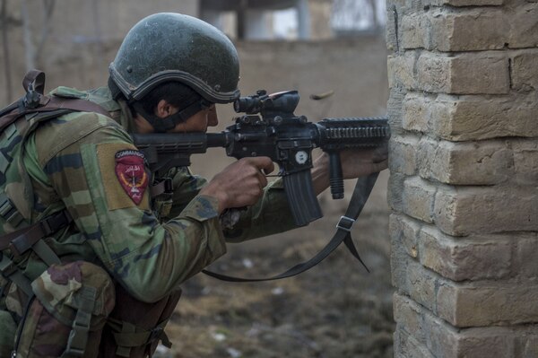 An Afghan national Army 10th Special Operations Kandak Commando returns fire during offensive operations against the Taliban in Kunduz province, Afghanistan, Jan. 20, 2018. (U.S. Air Force photo by Senior Airman Sean Carnes)