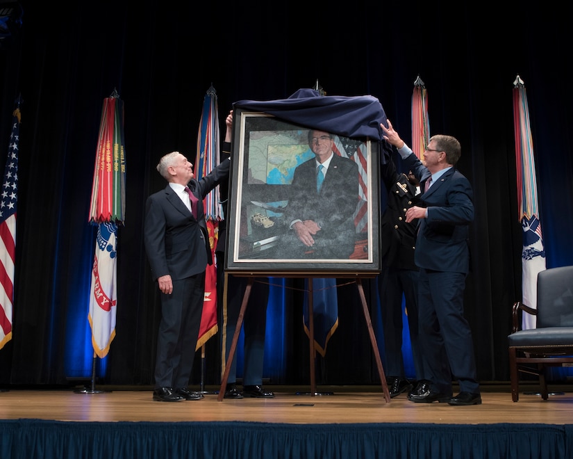 Defense Secretary James N. Mattis and former Defense Secretary Ash Carter unveil Carter’s official portrait at the Pentagon Auditorium.