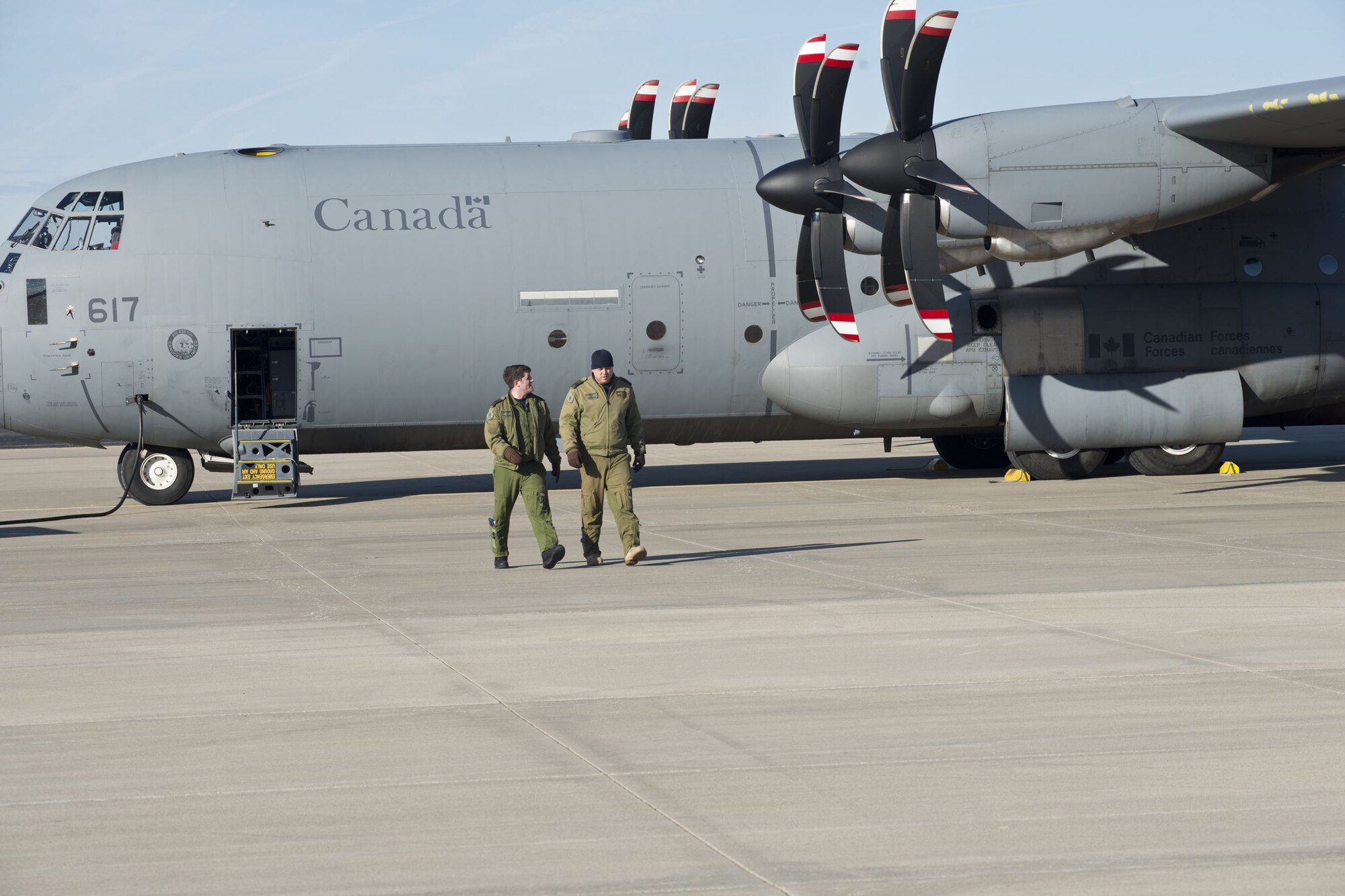 Royal Canadian Air Force members prepare their CC-130J aircraft for a Treaty on Open Skiestraining sortie at Rosecrans Memorial Airport, St. Joesph, Mo. February 2, 2018. Personnel from the United States, Canada, United Kingdom, France and the Czech Republic participated in the flight designed to promote international cooperation and transparency. (U.S. Air National Guard photo/Tech. Sgt. John Hillier)